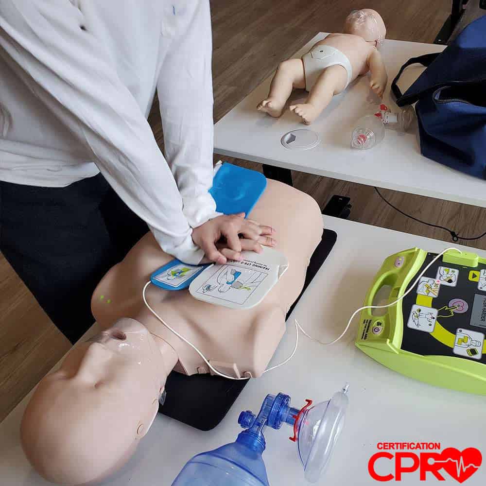 CPR training with mannequin and AED for certification in Tallahassee.